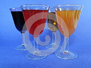 Diferent Cups with cocktails a blue background