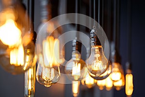 Diferent vintage tungsten filament lamps hanging from the ceiling