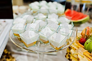 Diferrent cup cakes at wedding reception table.