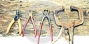 Differen size of pliers on wood