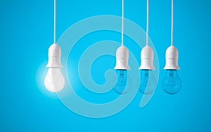 Difference light bulb on blue background. concept of new ideas photo