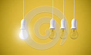 Difference light bulb on yellow background. concept of new ideas