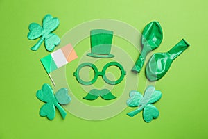 Different accessories of St.Patrick`s Day on green background