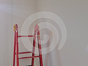 Different angles of a painter& x27;s ladder in a room to be refurbished