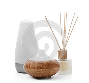 Different aroma oil diffusers on white background. photo