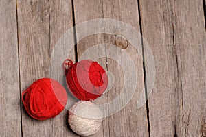 Different balls of yarn on rastic background photo