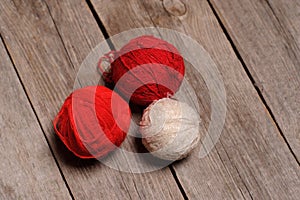 Different balls of yarn on rastic background