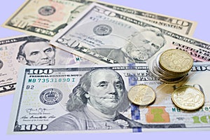 Different banknotes paper dollars and metal coins, cents close-up