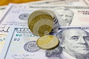 Different banknotes paper dollars and metal coins, cents close-up