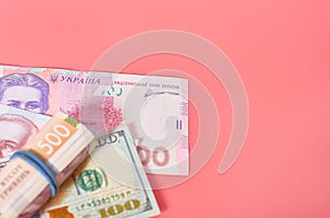 Different banknotes on pink background. Payment of pensions, salaries