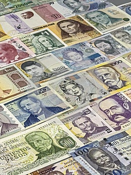 Different banknotes from various countries displayed on a table