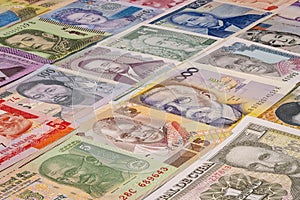 Different banknotes from various countries displayed on a table