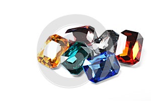 Different beautiful bright gemstones on background