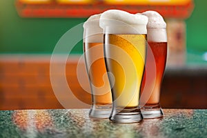 Different beer in glasses in pub