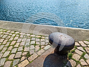 Different bollards in front of the water at the port of kiel