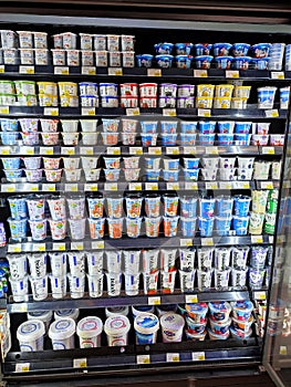 Different brands of Greek yogurt displayed in opss chiller