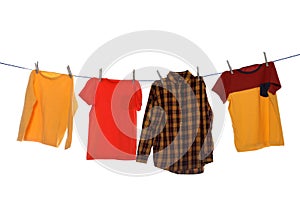 Different bright clothes drying on washing line against background