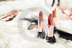 Different bright lipsticks on dressing table
