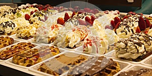 Different cakes with fruit and cream