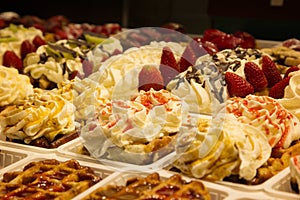 Different cakes with fruit and cream