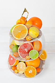 Different citrus fruit on cake stand