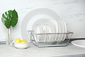 Different clean plates in dish drying rack