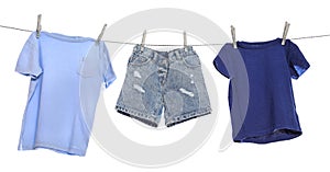 Different clothes drying on washing line against background