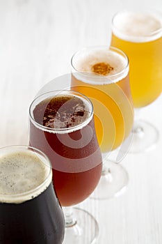 Different cold craft beer, side view. Close-up