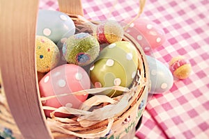 Different color eggs in a easter basket