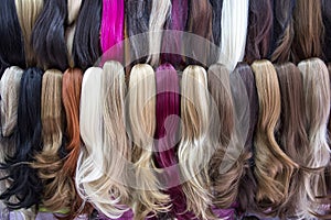 Different color human hair extensions in wig shop