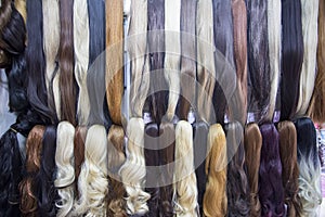 Different color human hair extensions in wig shop