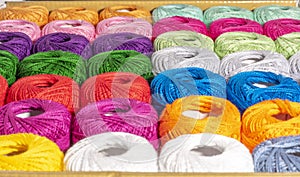 Different colored bag of wool