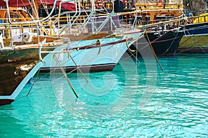 Different colored boats yachts moored in a harbor