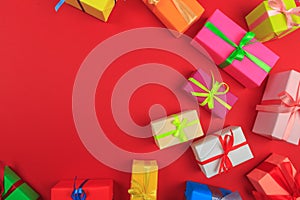 Different colored gift box on color background. Top view of various present boxes on minimal background. Birthday, Christmas,