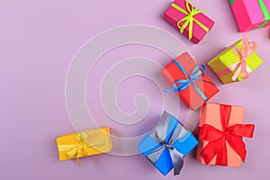 Different colored gift box on color background. Top view of various present boxes on minimal background. Birthday, Christmas,