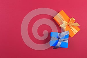 Different colored gift box on color background. Top view of various present boxes on minimal background. Birthday, Christmas,