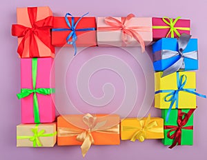 Different colored gift box on color background. Top view of various present boxes on minimal background. FRAME .Birthday,