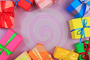 Different colored gift box on color background. Top view of various present boxes on minimal background. FRAME .Birthday,