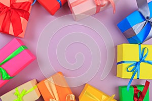 Different colored gift box on color background. Top view of various present boxes on minimal background. FRAME .Birthday,