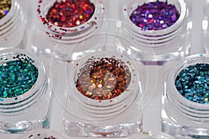 Different colored glitters in transparent jars