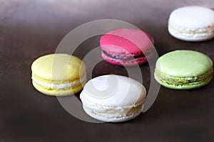 Macarons on the brown background