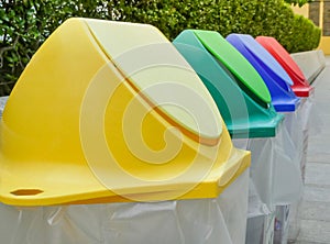 Different colored recycle garbage trash Bins in the park.