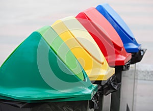 Different colored recycle garbage trash Bins in the park.