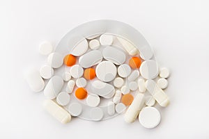 Different colored tablets on a white background close