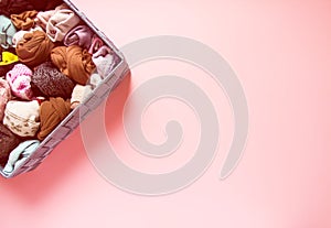 Different colorfl socks in fabric box. Warm clothes vertical storage