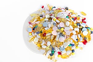 Different colorful medication and pills from above on white background