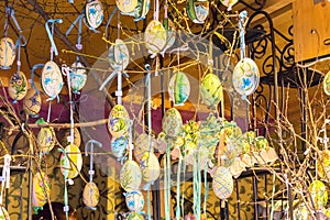 Different colorful painted Easter eggs on the tree at traditional European market