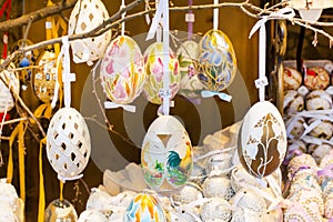 Different colorful painted Easter eggs on the tree at traditional European market