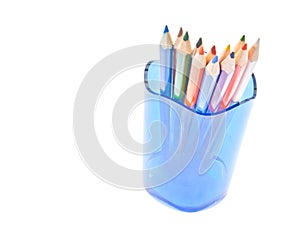 Different colorful pencils in glass