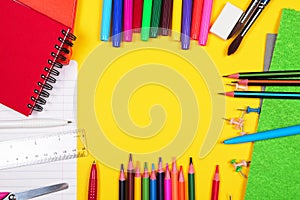 Different colorful School supplies on yellow background. Back to school sale, sopping concept. Copy space